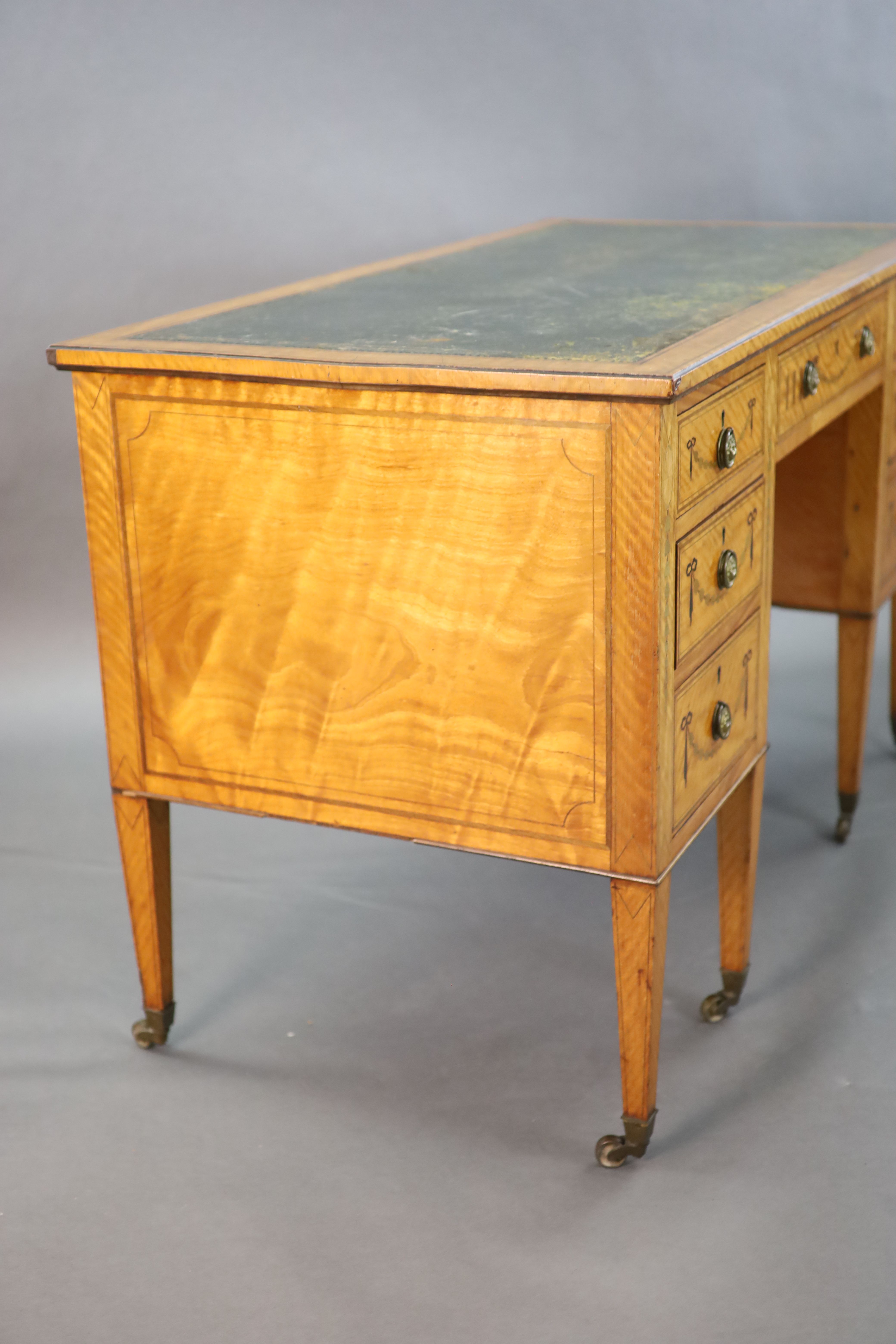 An Edwardian Edwards & Roberts marquetry inlaid satinwood kneehole desk, W.4ft D.2ft H.2ft 6in.
